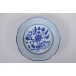 A blue and white porcelain steep sided dish with lobed rim and lotus flower decoration, Chinese