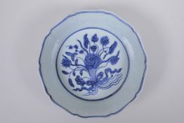 A blue and white porcelain steep sided dish with lobed rim and lotus flower decoration, Chinese