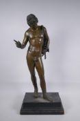 A C19th Grand Tour bronze figure of Narcissus, mounted on a wooden stand, 66cm high