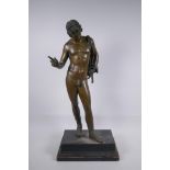 A C19th Grand Tour bronze figure of Narcissus, mounted on a wooden stand, 66cm high