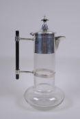A Christopher Dresser style silver plate and glass decanter, 28cm high