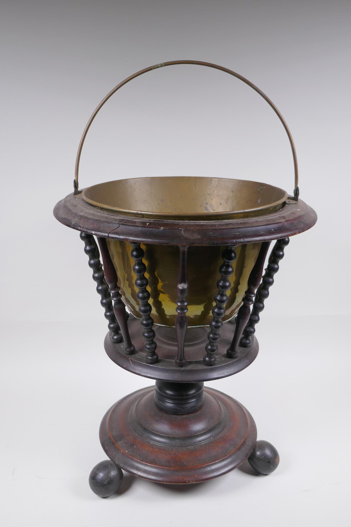 A Dutch wood and brass lined peat bucket with ring turned spindles, AF, 42cm high x 36cm diameter - Image 3 of 5