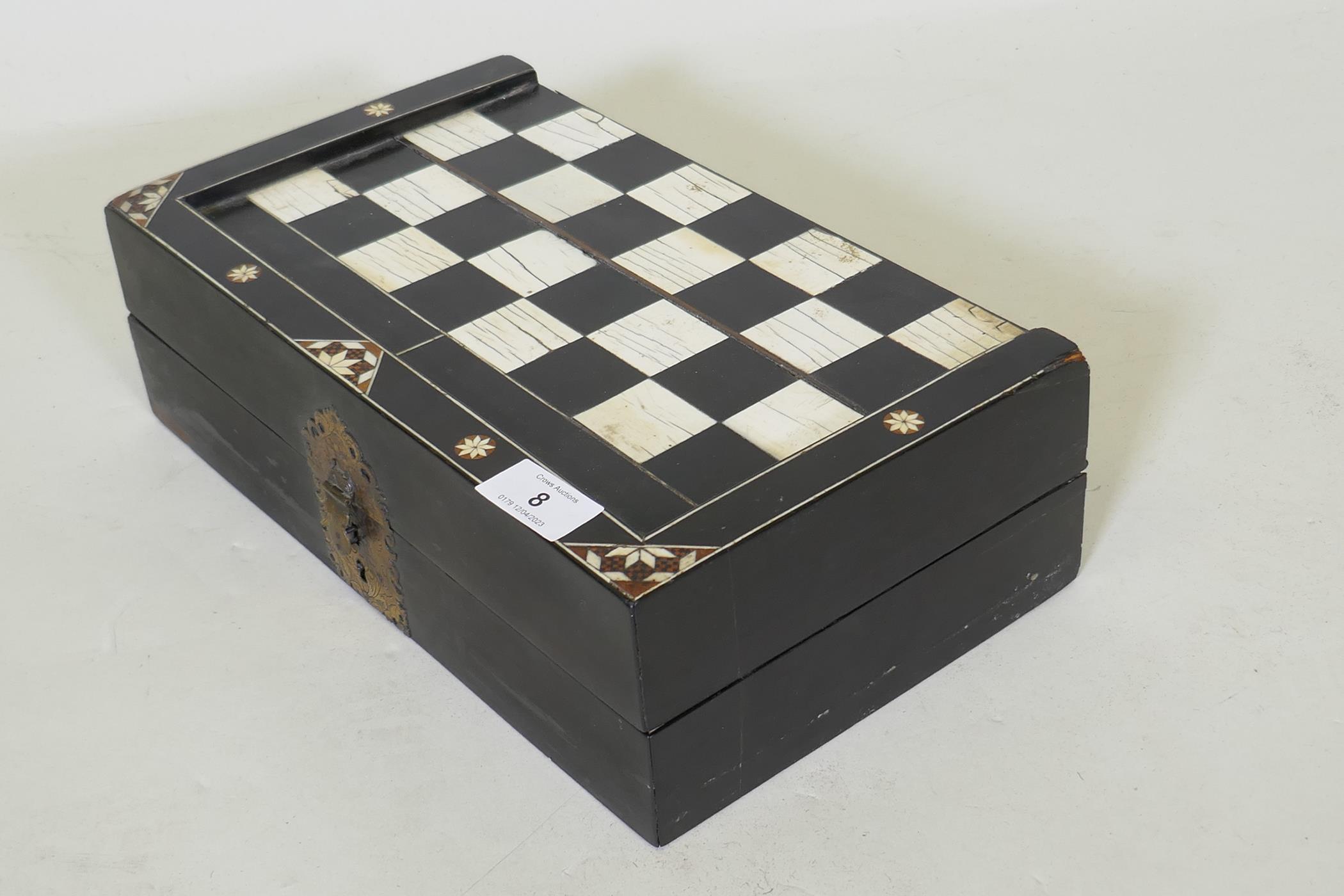 A C19th ebony and ivory and stained bone games box, with chequer board top and backgammon - Image 3 of 4