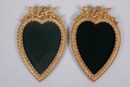 A pair of ormolu heart shaped photograph frames, 13 x 18cm