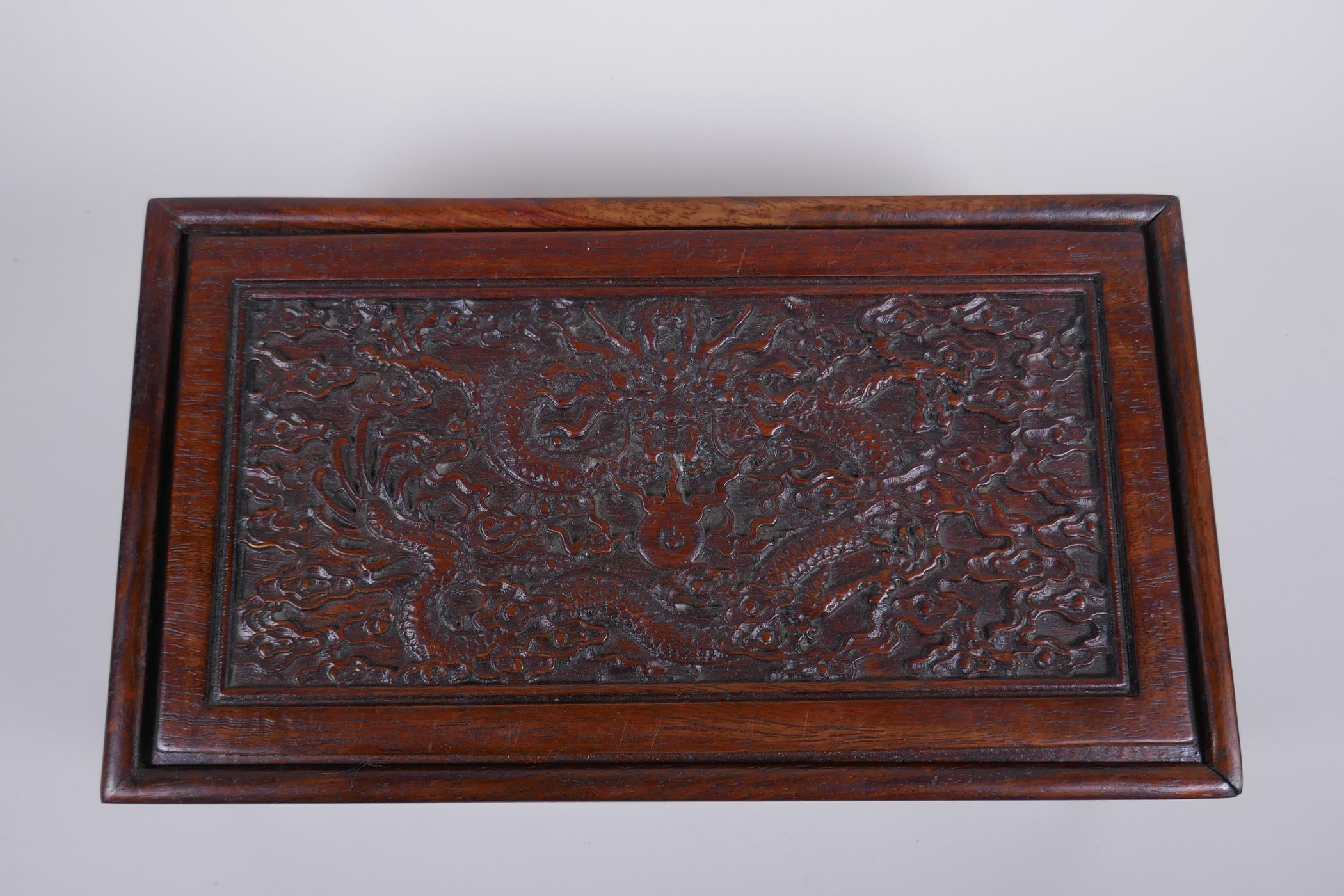 A Chinese carved hardwood box with dragon and character decoration, 28 x 16cm - Image 2 of 4