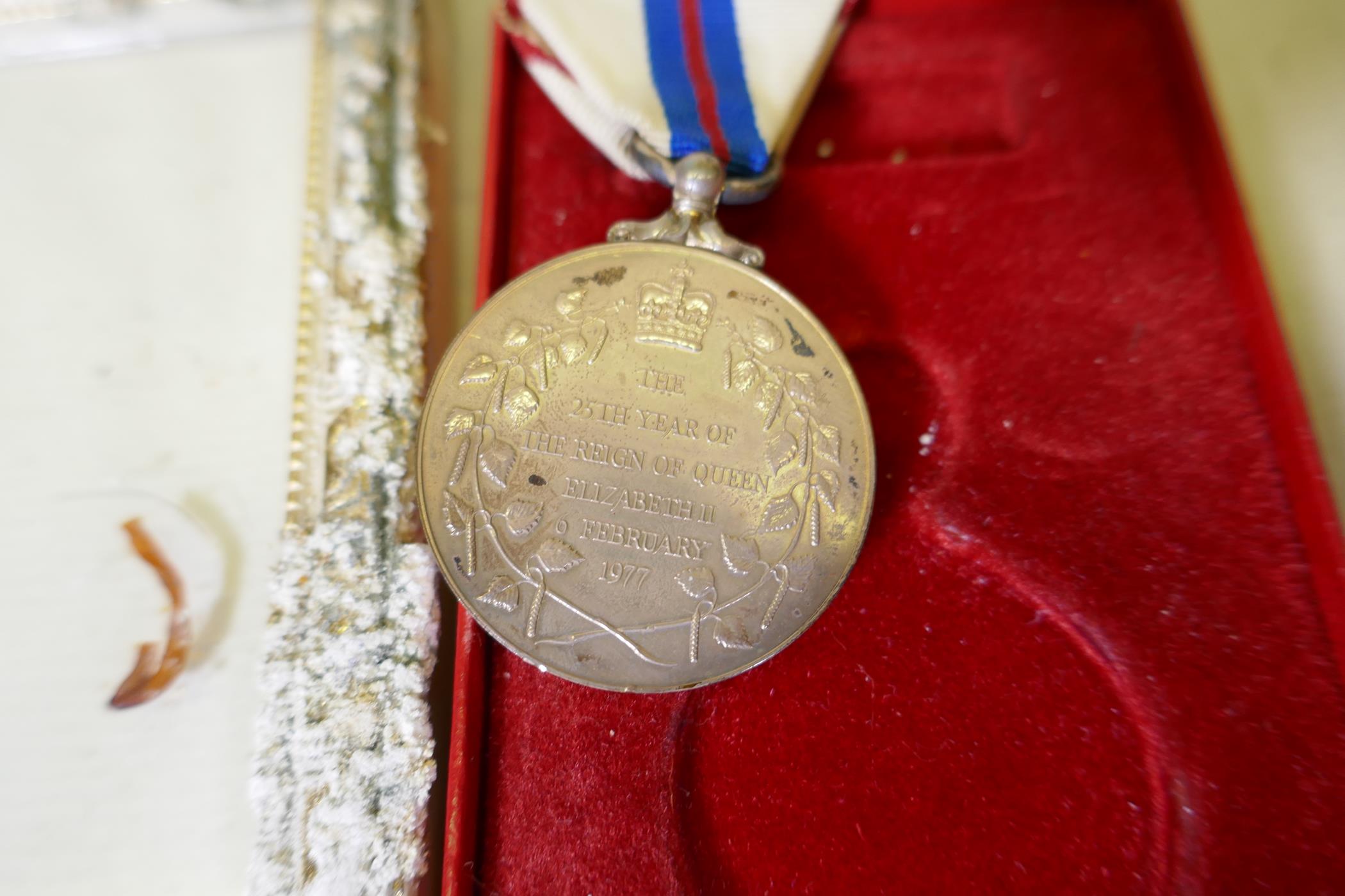 An Elizabeth II Silver Jubilee medal with ribbon in original case, with citation - Image 3 of 3