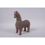 A middle eastern painted terracotta horse, 21cm high