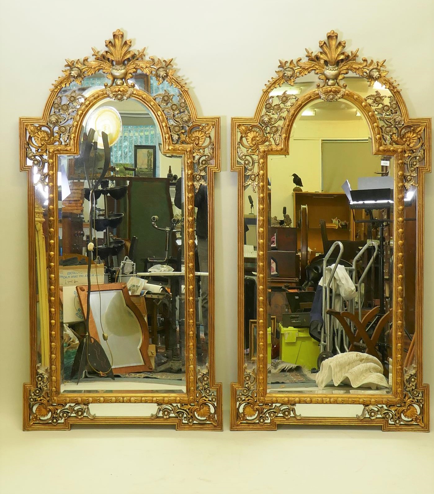 A pair of Rococo style gilt composition wall mirrors with moulded floral detail, 99 x 198cm high