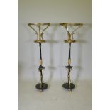 A pair of C19th Empire style iron and ormolu torcheres, adapted, 124cm high, 37cm diameter