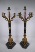 A pair of Empire style bronze and ormolu Corinthian column four branch candelabra, 80cm high