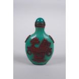 A Peking glass snuff bottle with raised decoration of objects of vitue