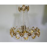 A 1960s gilt metal Empire inspired chandelier with glass drops, 50cm drop excluding chain