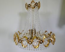 A 1960s gilt metal Empire inspired chandelier with glass drops, 50cm drop excluding chain