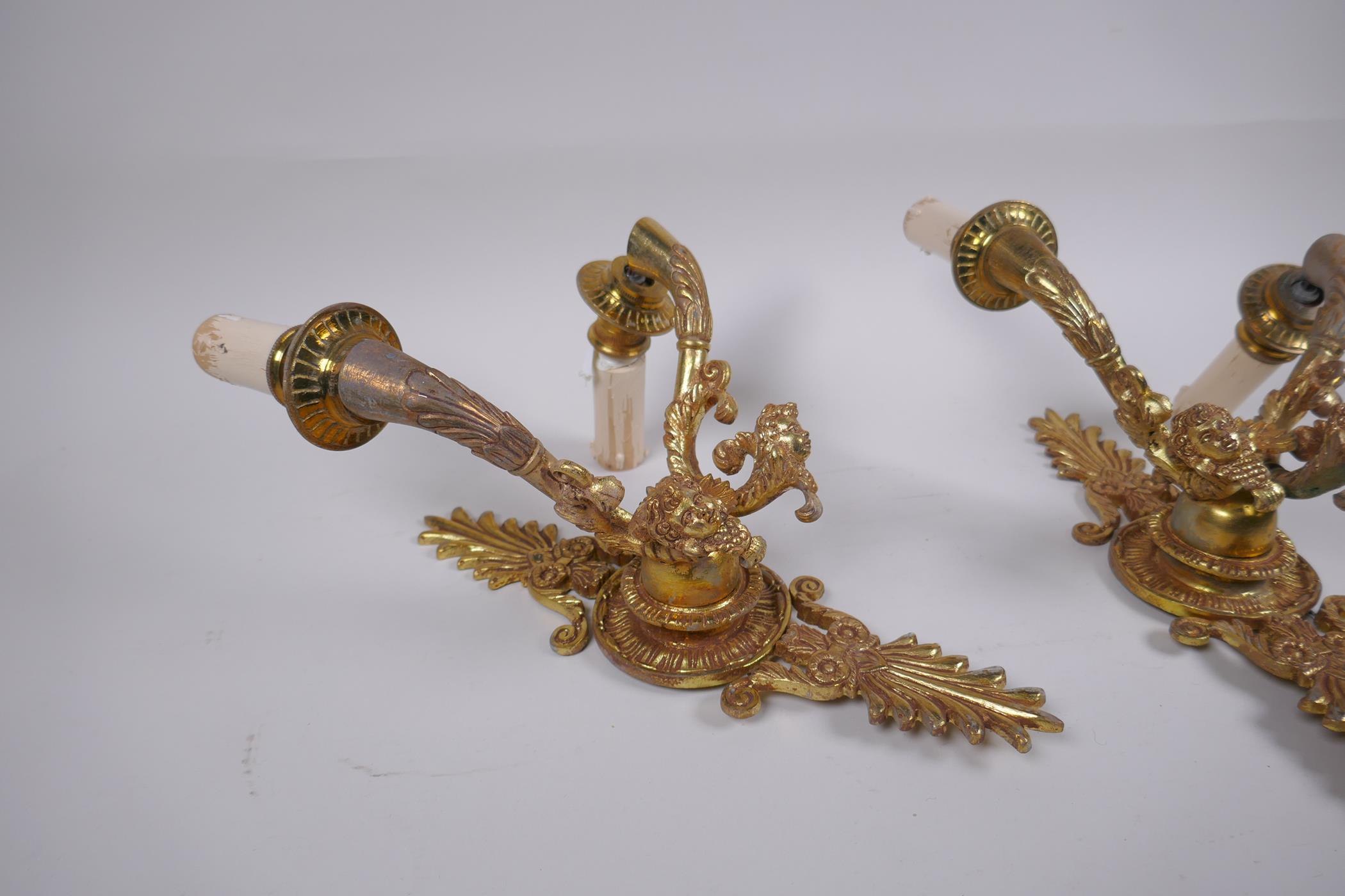 A pair of ormolu two branch wall sconces with putti mask decoration, 30cm high - Image 2 of 4