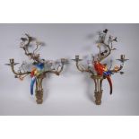A pair of polychrome porcelain and gilt metal two branch parrot wall sconces with decorative