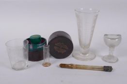 A collection of antique medical instruments to include a boxed medicine glass and minimum measure, a