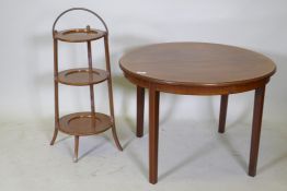 A Victorian inlaid mahogany occasional table, together with a walnut three tier folding cake