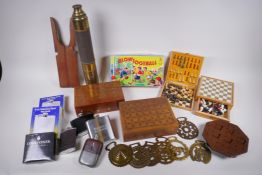 A collection of vintage travel sized board games, a brass telescope, and quantity of hip flasks, two