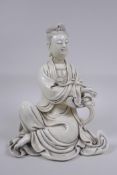 A Chinese blanc de chine porcelain figure of Quan Yin, impressed seal mark to the reverse, 25cm high