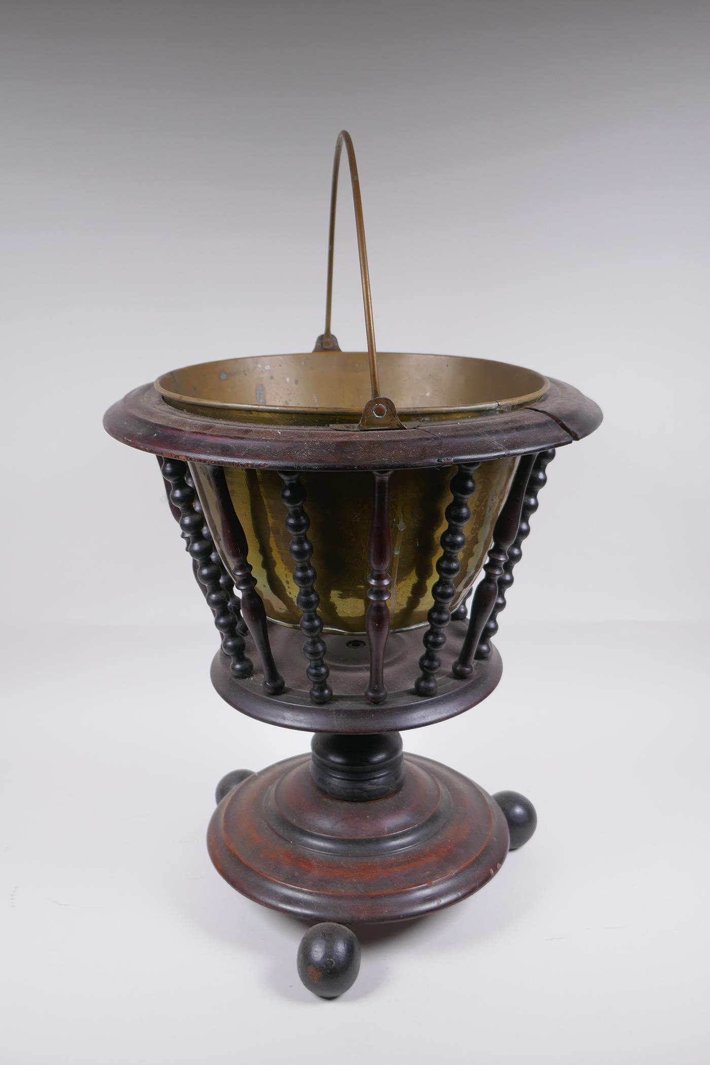 A Dutch wood and brass lined peat bucket with ring turned spindles, AF, 42cm high x 36cm diameter - Image 4 of 5