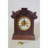 Oak cased C19th Ansoma mantel clock, with porcelain dial, striking on a gong, 24cm high