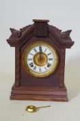 Oak cased C19th Ansoma mantel clock, with porcelain dial, striking on a gong, 24cm high
