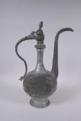 An Iranian white metal ewer with engraved decoration, 39cm high