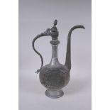 An Iranian white metal ewer with engraved decoration, 39cm high