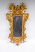 An Italian gilt wall mirror decorated with swags and masks, 28 x 65cm, losses