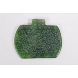 An Islamic spinach jade pendant with chased Islamic script decoration, 6 x 5cm