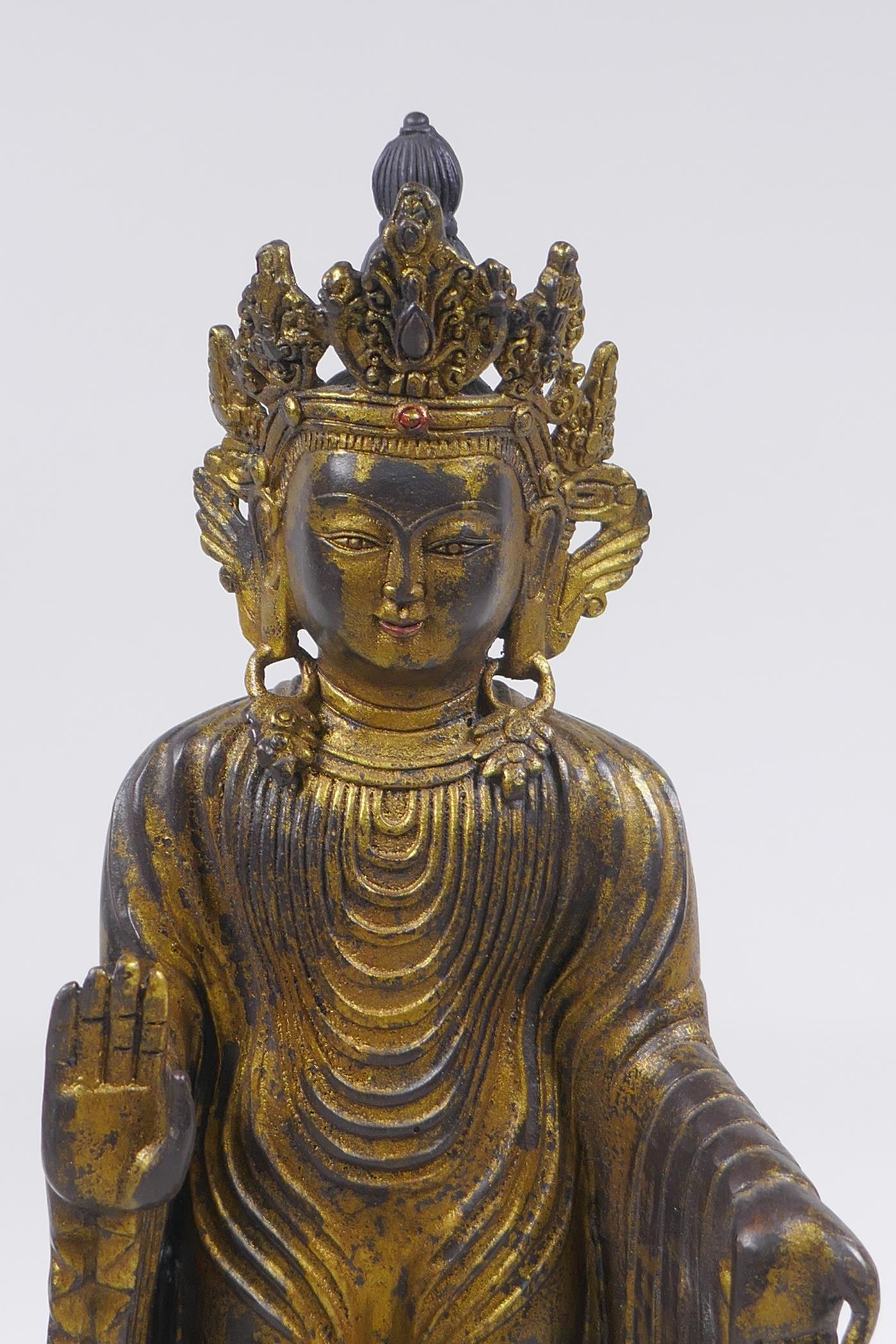 A Sino Tibetan gilt bronze figure of Buddha standing on a lotus flower, 32cm high - Image 2 of 6