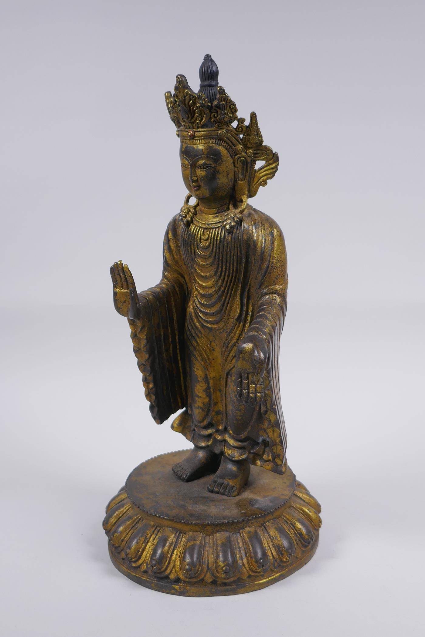 A Sino Tibetan gilt bronze figure of Buddha standing on a lotus flower, 32cm high - Image 5 of 6