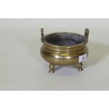 A Chinese polished brass censer with engraved dragon and phoenix decoration, seal mark to base, 16cm