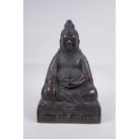 A Sino Tibetan bronze figure of a bearded deity seated in meditation, 29cm high