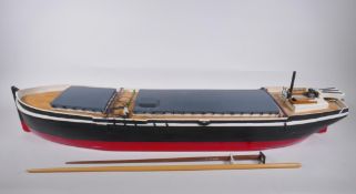 A scratch built radio control barge, 92cm long, 24cm wide