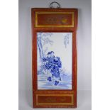 A Chinese Republic blue and white porcelain plaque depicting figures in a landscape, mounted in a