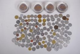 A quantity of assorted world coinage, together with four 1979 Cowes Week medallion paperweight, 7.