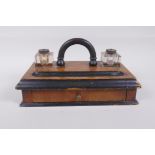 An antique ebonised walnut desk set with twin glass ink wells and a single drawer, 28 x 16cm