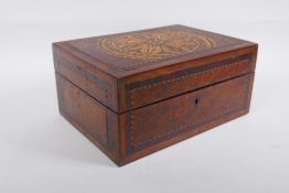 A Victorian inlaid burr walnut work box with parquetry decoration to the lid, 28 x 20cm, 13cm high