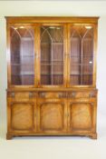 A Georgian style mahogany bookcase/display cabinet, the upper section with dentil cornice,