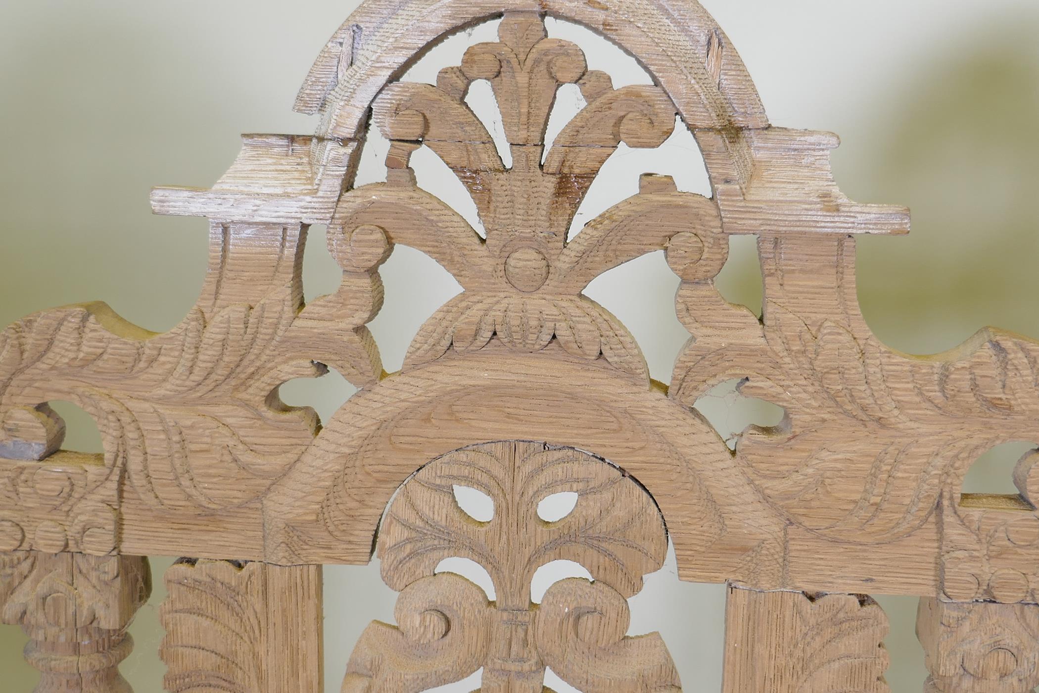 A pair of French C19th oak high back chairs with carved and pierced backs, 128cm high, AF - Image 3 of 3