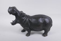 A cast bronze hippopotamus with gaping mouth, 34cm long