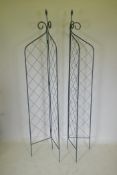 A pair of folding wrought iron folding garden trellises, 214cm high