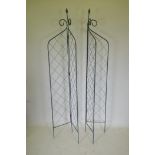 A pair of folding wrought iron folding garden trellises, 214cm high