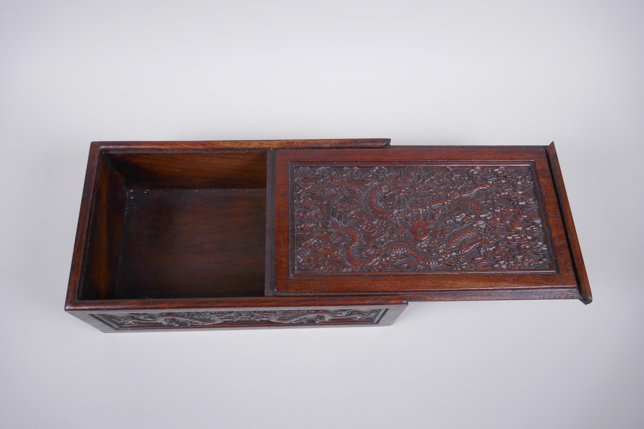 A Chinese carved hardwood box with dragon and character decoration, 28 x 16cm - Image 3 of 4