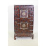 An oriental hardwood cabinet with brass mounts and auspicious character decoration, foot loose, 56 x