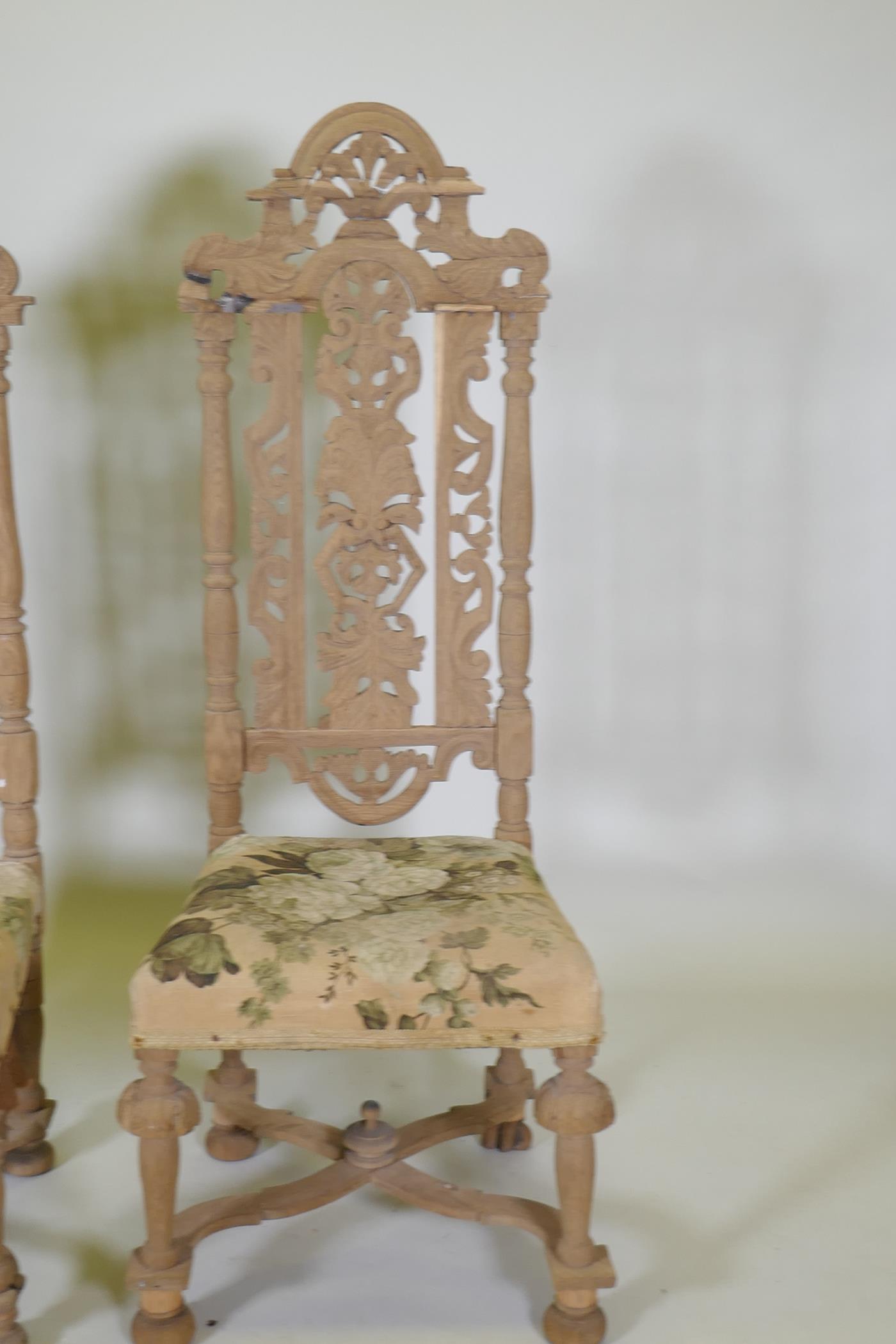 A pair of French C19th oak high back chairs with carved and pierced backs, 128cm high, AF - Image 2 of 3