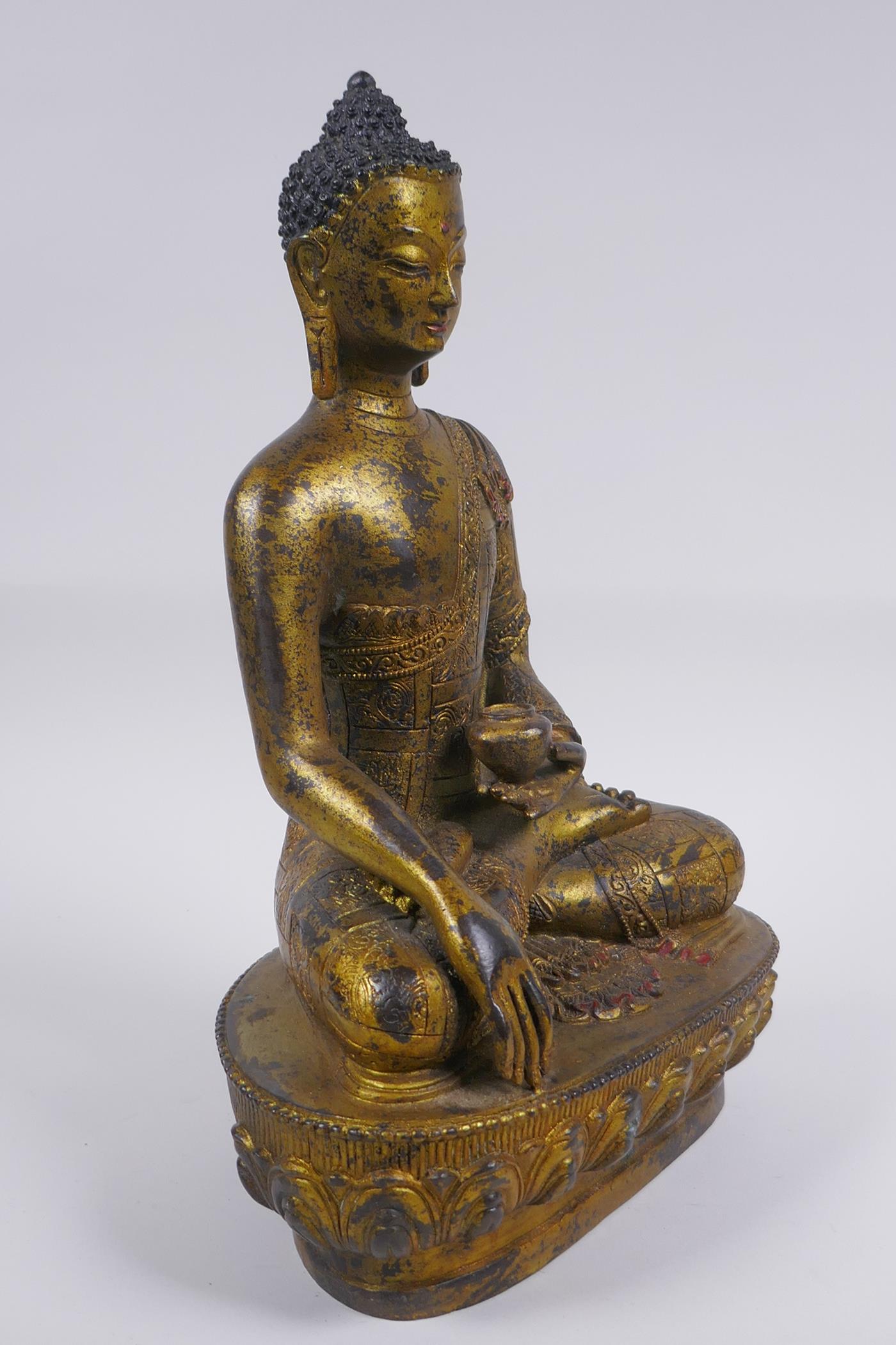 A Sino Tibetan filled gilt bronze figure of Buddha, impressed double vajra mark to base, 30cm high - Image 3 of 6