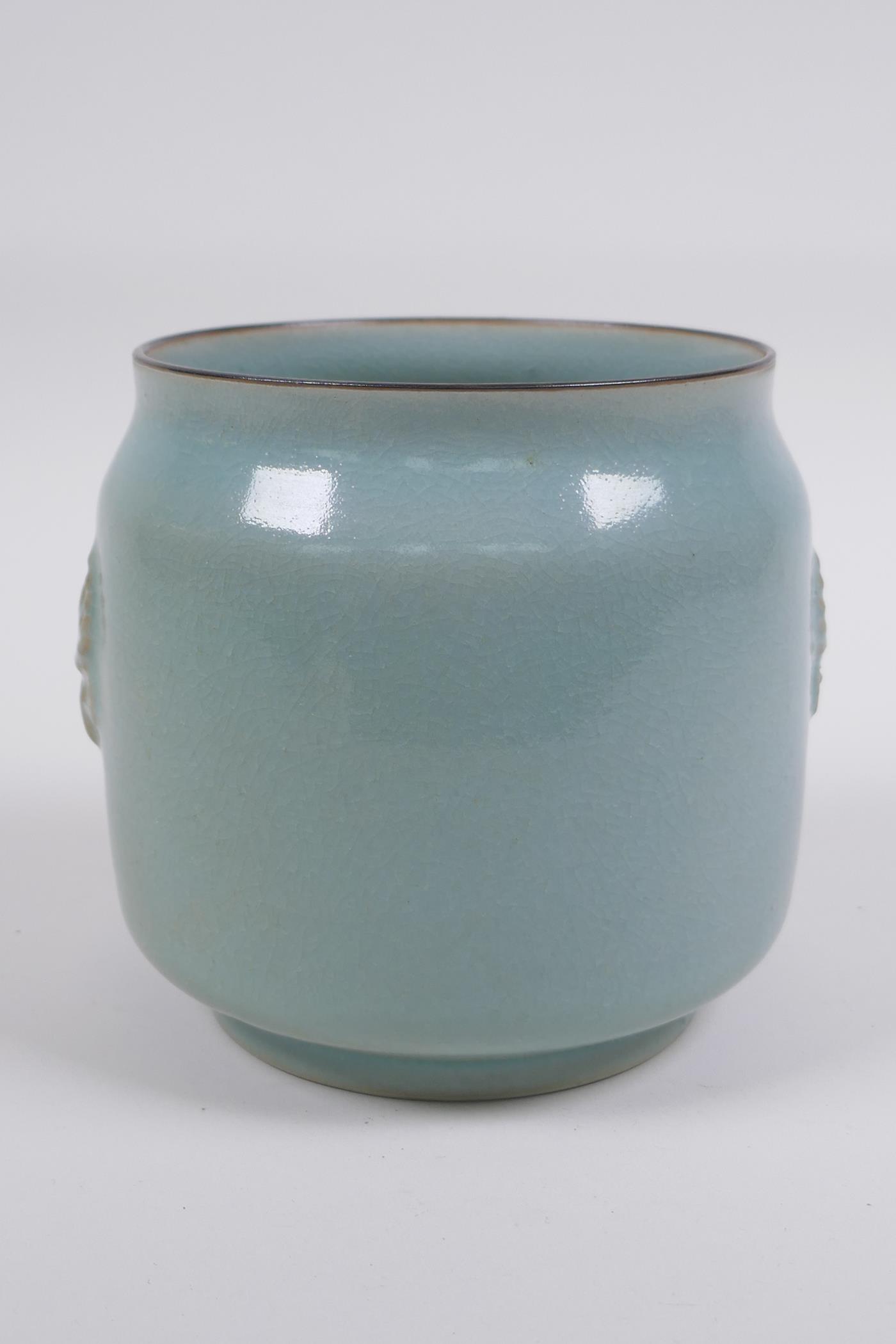 Chinese Ru ware style celadon glazed jar with twin mask decoration, 12cm high x 12cm diameter - Image 2 of 5