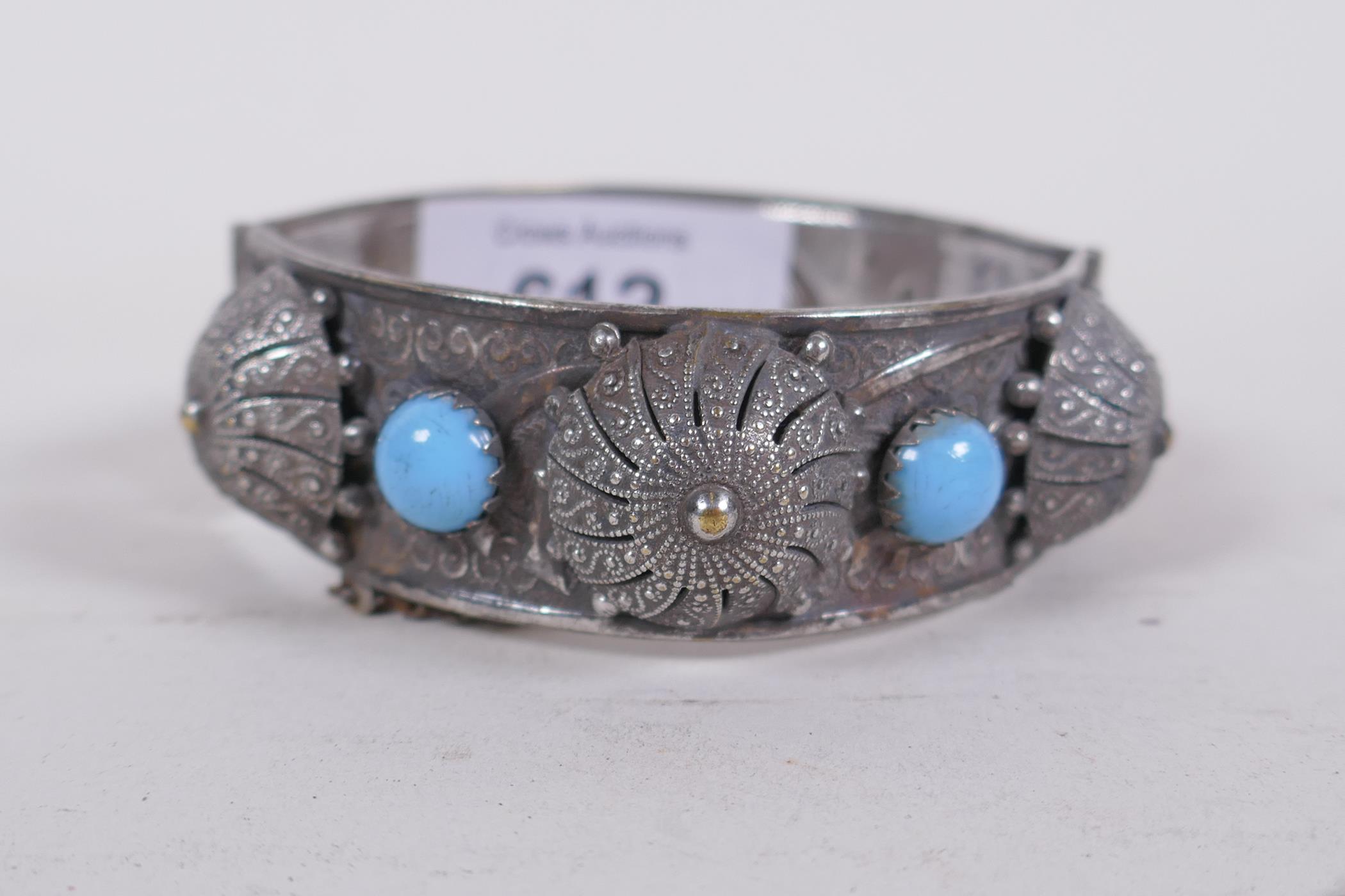 An Algerian silver bangle, inset with turquoise stones, 6cm diameter, and a similar white metal link - Image 2 of 5